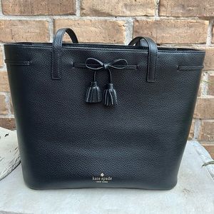 Leather Kate spade tote, bow & tassel, pink interior zipper compartment inside.